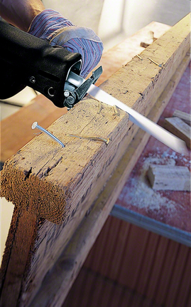 Reciprocating saw blade S 922 HF Worker wearing safety equipment uses a reciprocating saw to cut through a wooden beam.