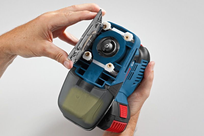 GSS 18V-10 Person changing the sanding pad on a cordless orbital sander.