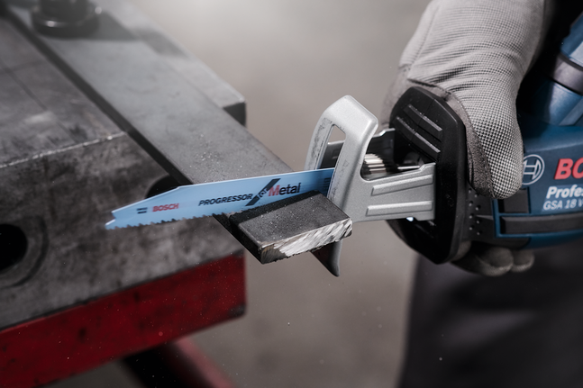 Reciprocating saw blade S 123 XF A worker wearing safety equipment cuts a metal bar using a reciprocating saw.