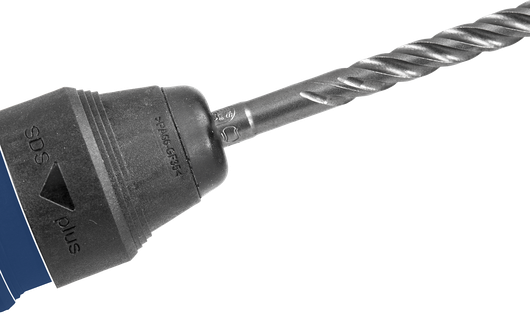 Rotary hammer drill with a spiral bit fitted in the chuck.