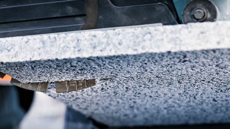 PRO Stone Diamond Disc, 180 x 22.23 mm Diamond drill making a precise hole in a thick stone slab.