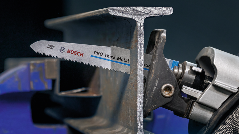 PRO Thick Metal Demolition S930CF Blade, 1.6 x 22 x 150 mm, 5 pcs Reciprocating saw cutting through a thick metal beam.