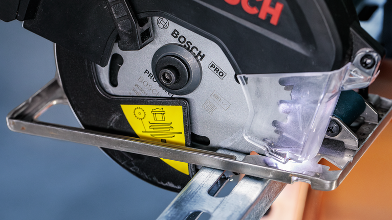 PRO Steel cordless Circular Saw Blade, 136 x 1.6 x 20 mm Power saw cutting through a metal beam with protective shield in place.