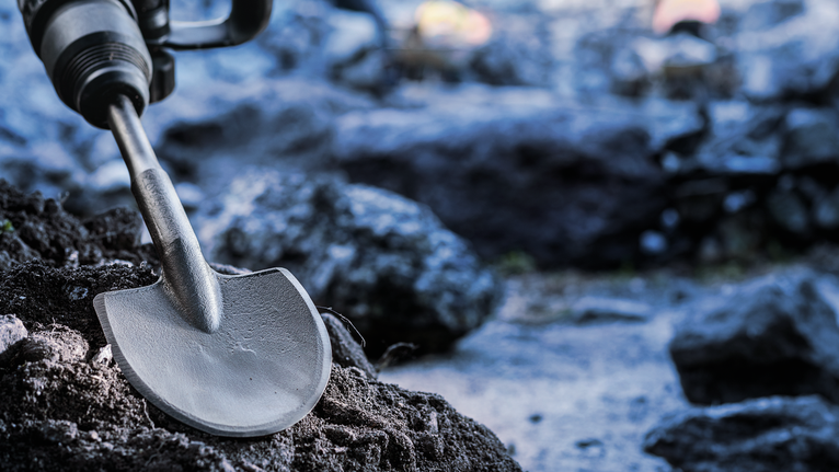 PRO SDS max Excavation Chisel, 110 x 400 mm Rotary hammer with a spade chisel breaks through rocky ground.