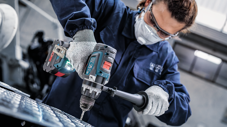 PRO Metal HSS-G Twist Drill Bit, 1/4 x 63 x 101 mm Person wearing safety equipment drills into metal.