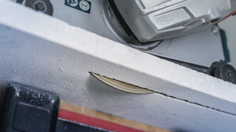 PRO Marble Diamond Disc, 115 x 22.23 mm Circular saw cutting through a white board.