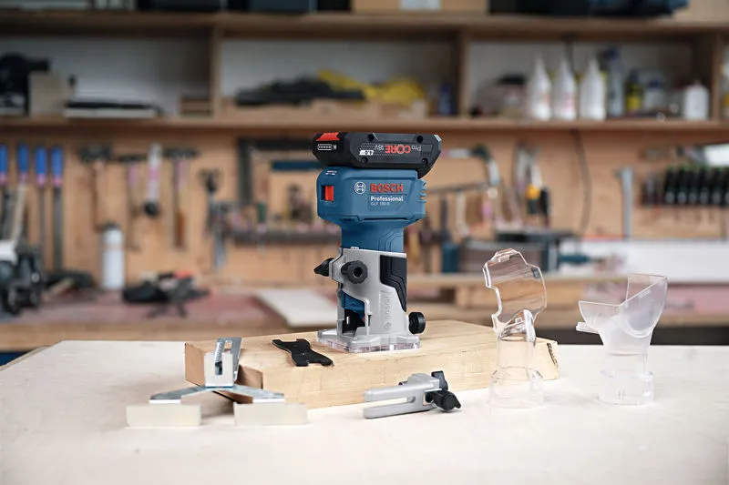 GLF 18V-8 Cordless trim router and attachments displayed on a workbench in a woodworking shop.