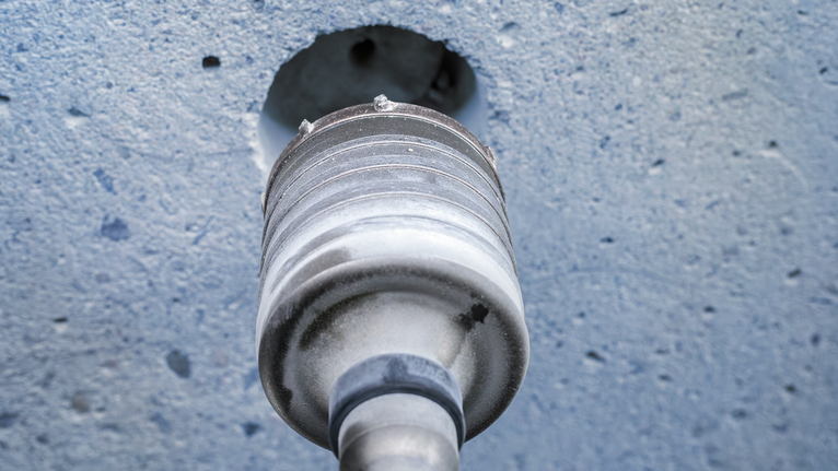 PRO SDS max-5 Core Cutter, 125 x 80 x 97 mm Core drill bit boring a circular hole into a concrete wall.
