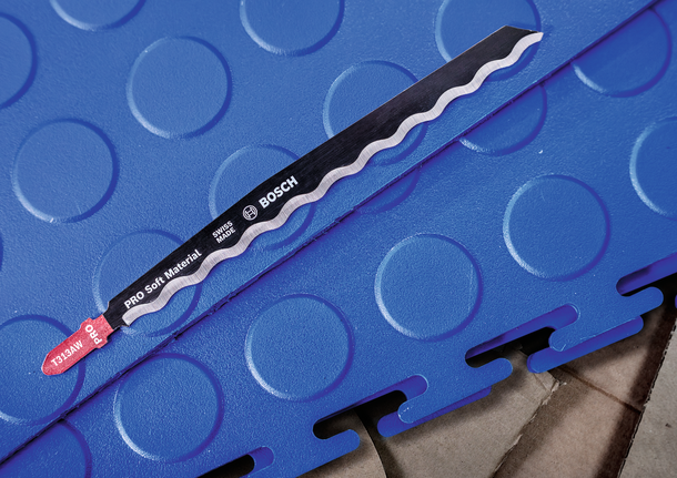 PRO Soft Material T313AW Jigsaw Blade, 152 mm, 3 pcs Jigsaw blade placed on interlocking blue foam flooring.