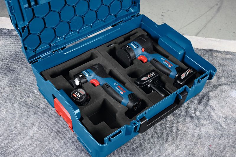 Blue carrying case with a polisher and two 12V cordless power tools secured in foam.