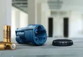 Blue battery holder on table.