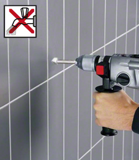Tile drill bit CYL-9 Ceramic A person drills into tiled wall using a power drill.