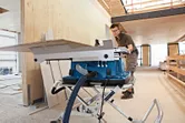 Man using table saw.